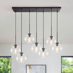 Seven-Globe Hanging Light with Adjustable Height Cords for Kitchen Island & Dining Table, Clear Glass Spheres, 35-Inch Canopy, E26 Base, Dim