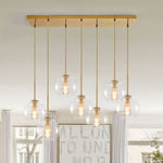 Seven-Globe Hanging Light with Adjustable Height Cords for Kitchen Island & Dining Table, Clear Glass Spheres, 35-Inch Canopy, E26 Base, Dim