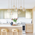 Seven-Globe Hanging Light with Adjustable Height Cords for Kitchen Island & Dining Table, Clear Glass Spheres, 35-Inch Canopy, E26 Base, Dim