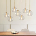 Seven-Globe Hanging Light with Adjustable Height Cords for Kitchen Island & Dining Table, Clear Glass Spheres, 35-Inch Canopy, E26 Base, Dim